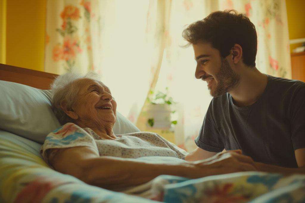 A grandson visiting with his grandmother.